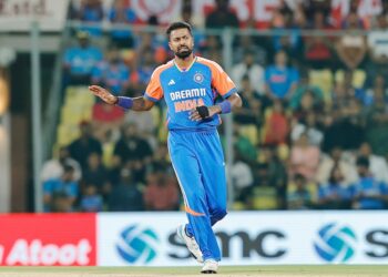 Hardik Pandya in action, delivering a performance for India during a cricket match.