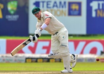 Steve Smith in action during a cricket match, showcasing his batting technique.